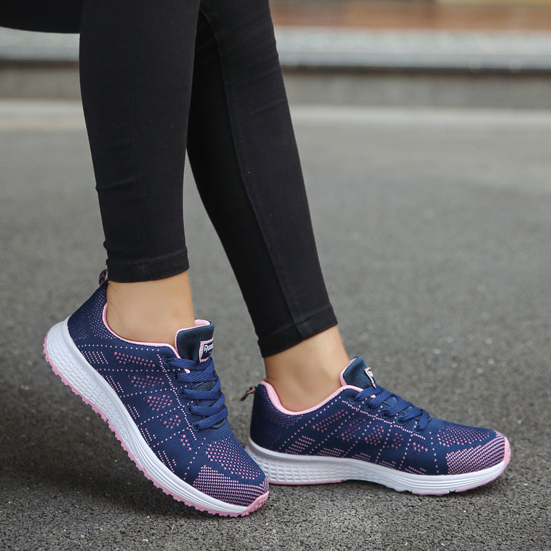 Navy knit lace-up sports sneakers with pink-speckle accents and white tread sole