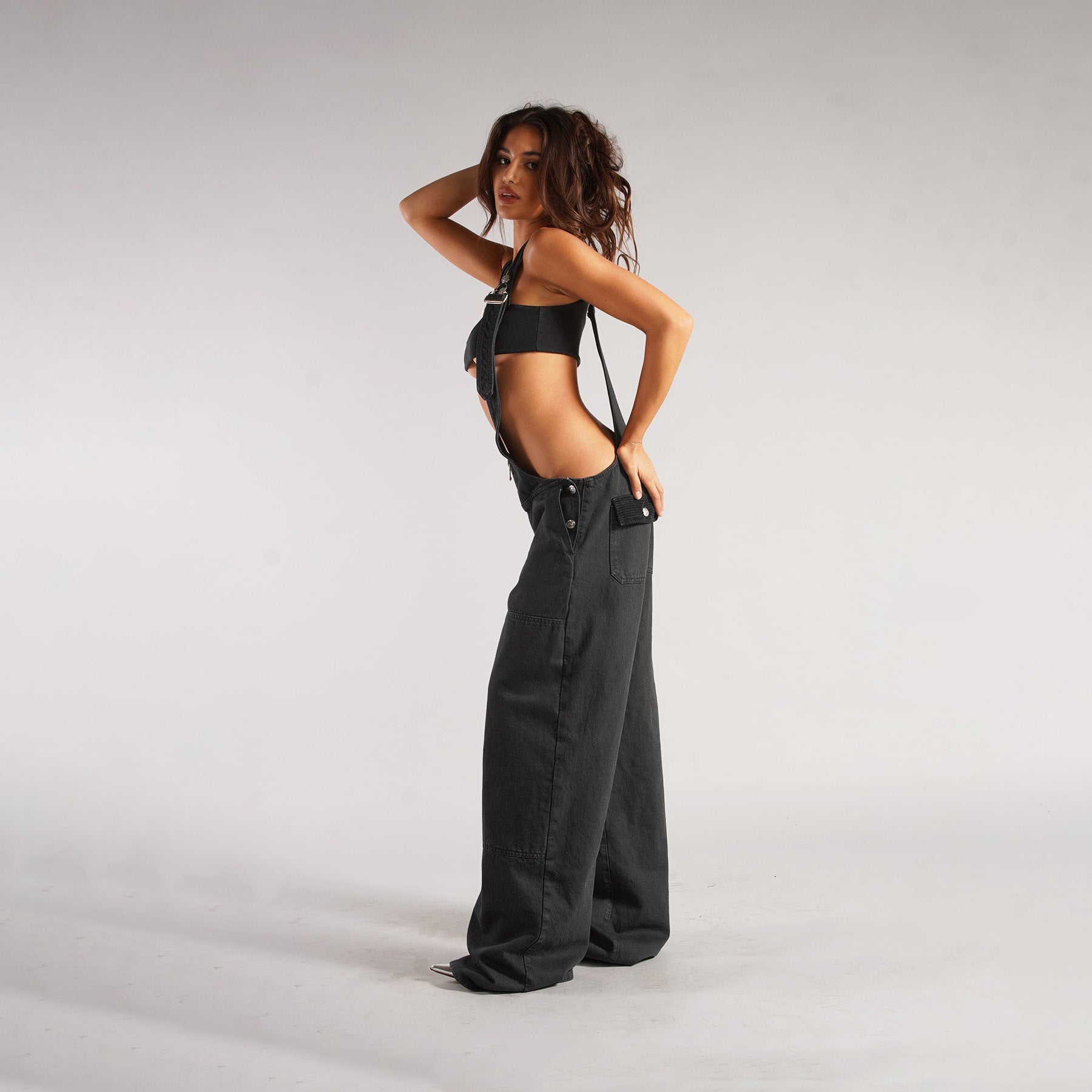Black denim zipper overalls with zipper bib, wide legs, side pockets, adjustable straps