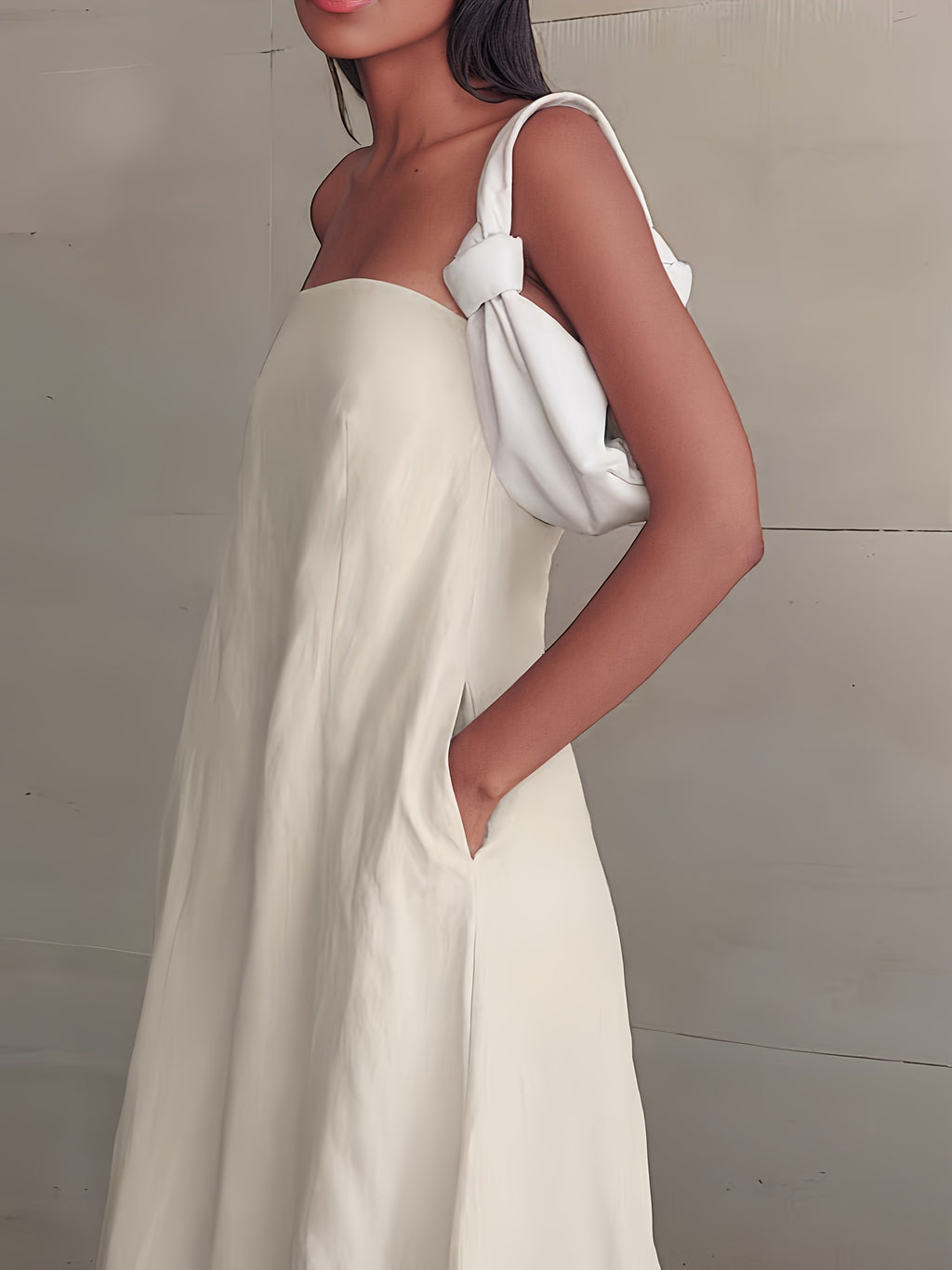 Strapless linen maxi dress in light cream with side tie and deep neckline