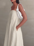 Strapless linen maxi dress in light cream with side tie and deep neckline