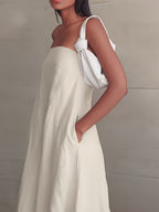 Strapless linen maxi dress in light cream with side tie and deep neckline
